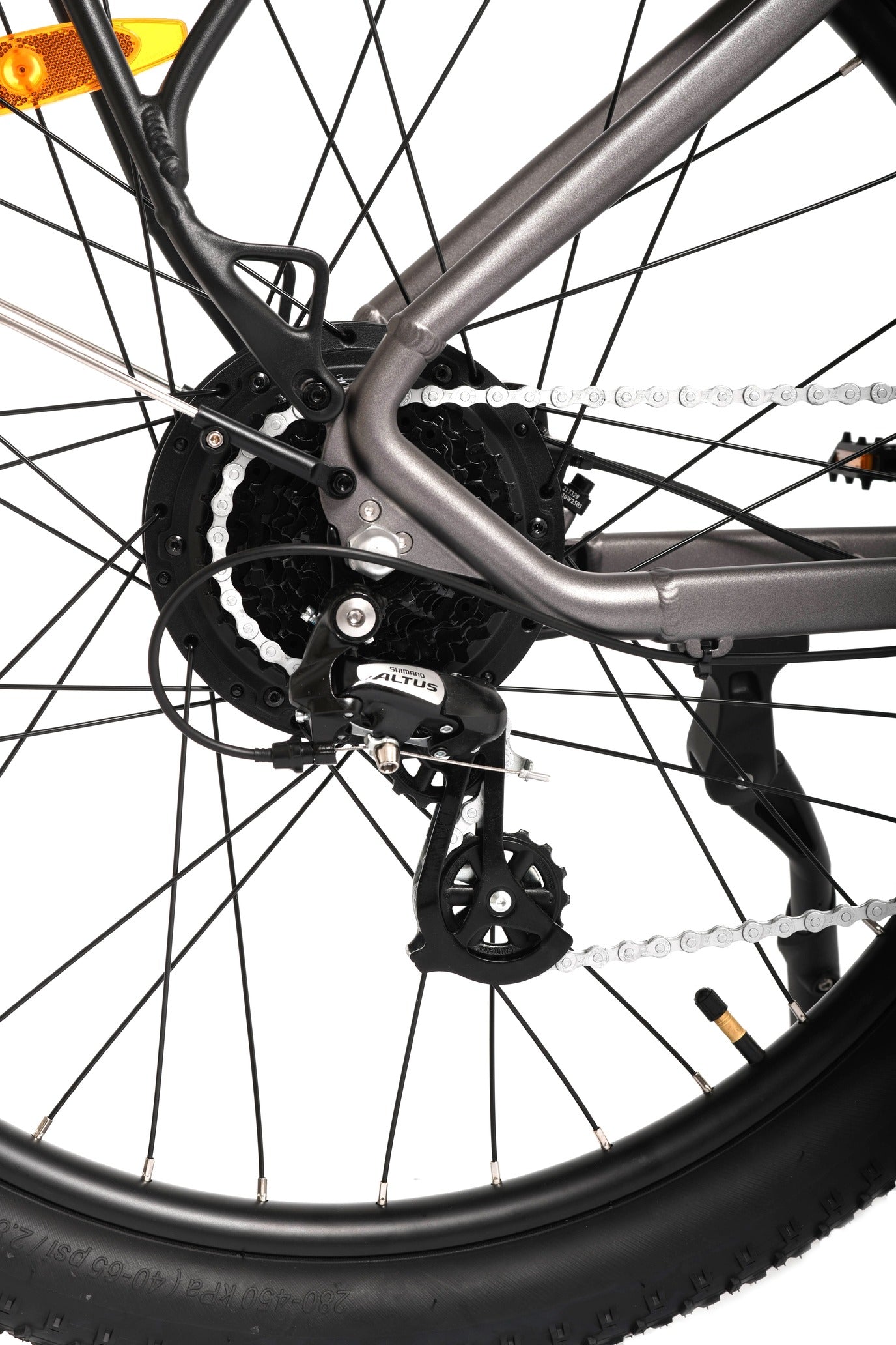 Close-up of a bicycle wheel and chain mechanism on a white background