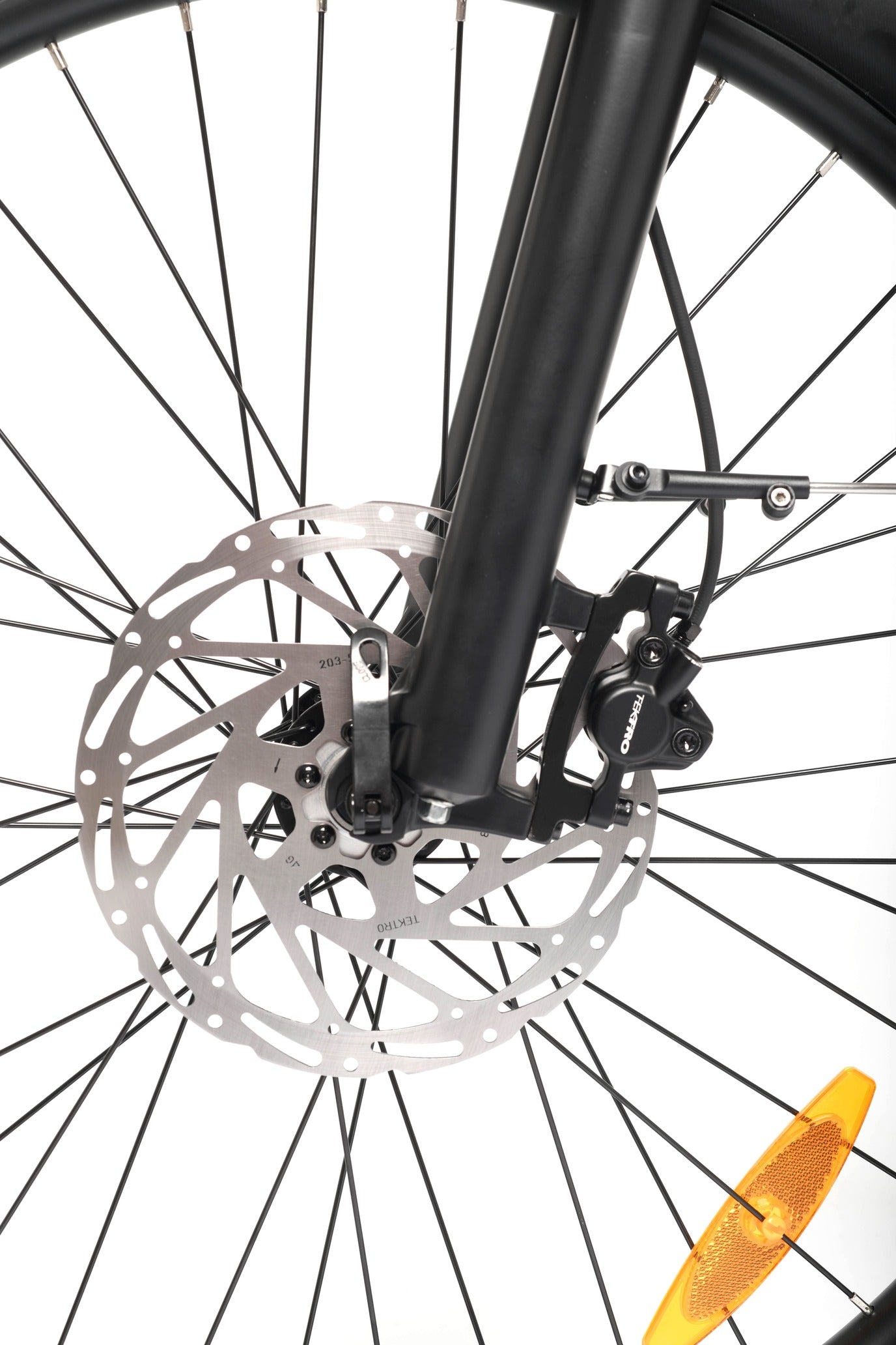 Close-up of a bicycle wheel with disc brake system on a white background