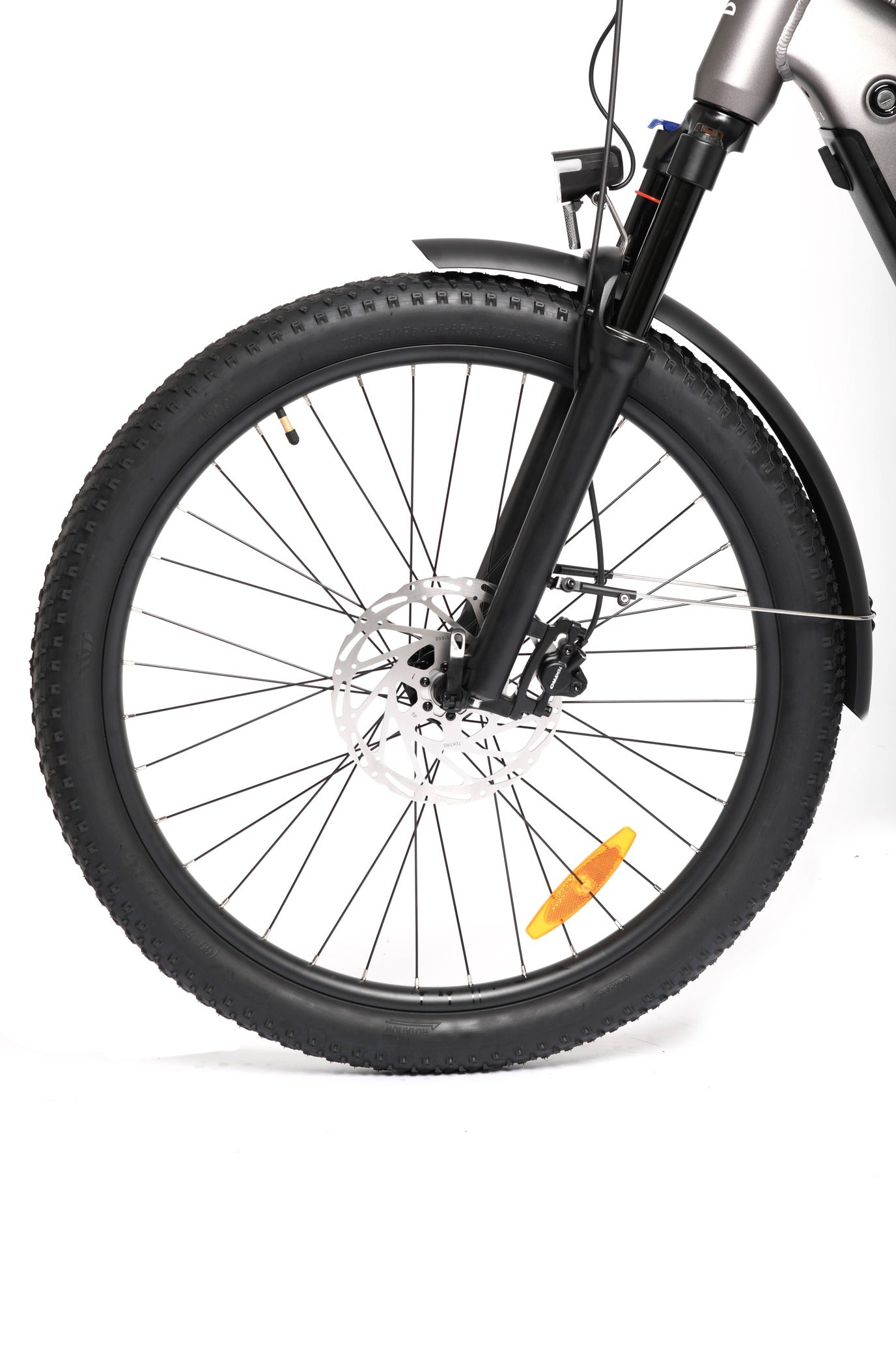 Close-up of a bicycle wheel with suspension fork on a white background