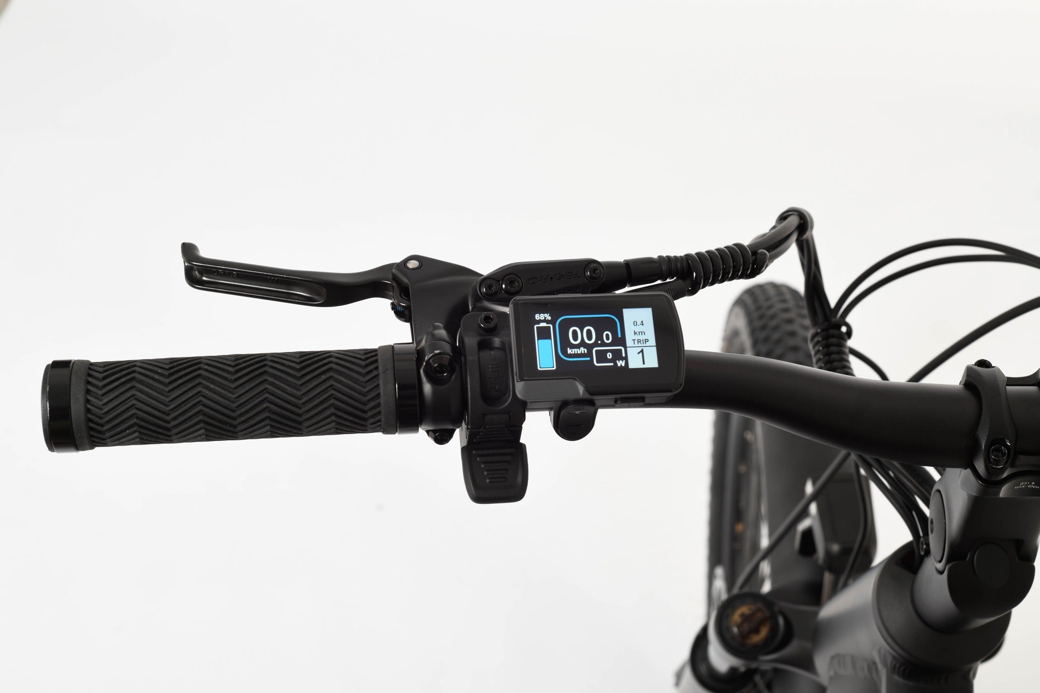 Close-up of bicycle handlebars with a digital display on a white background