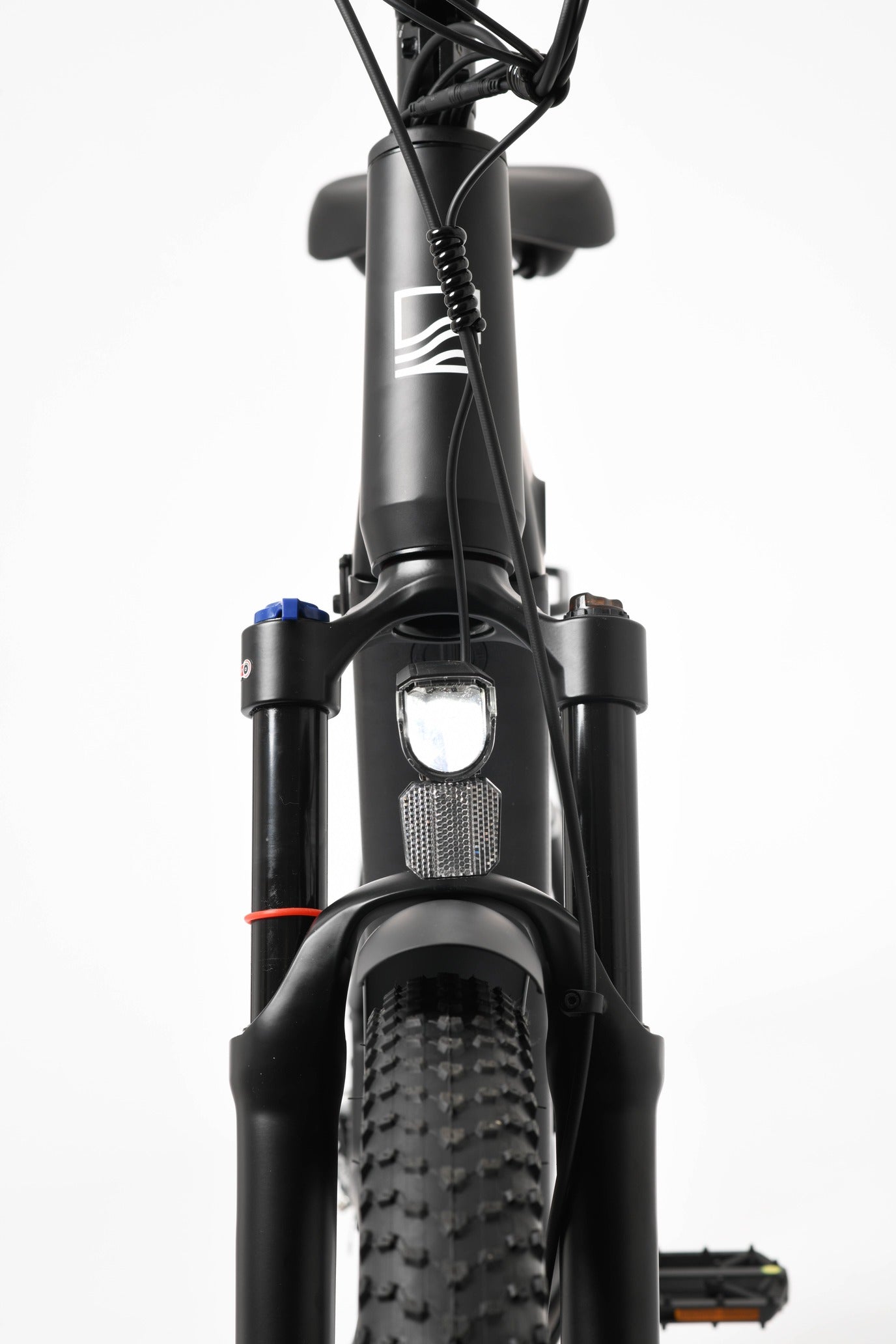 Close-up of a bicycle's suspension fork on a white background