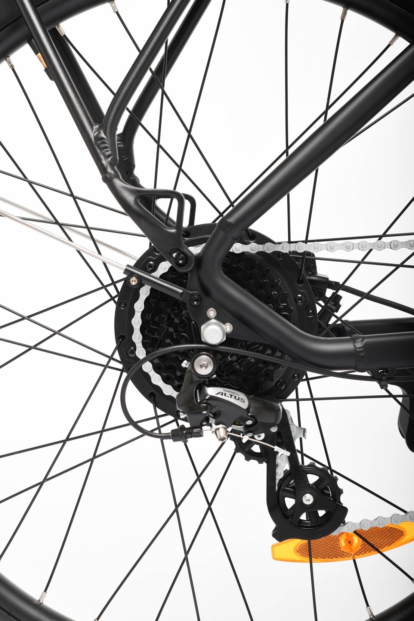 Close-up of a bicycle chain and gear system on a white background