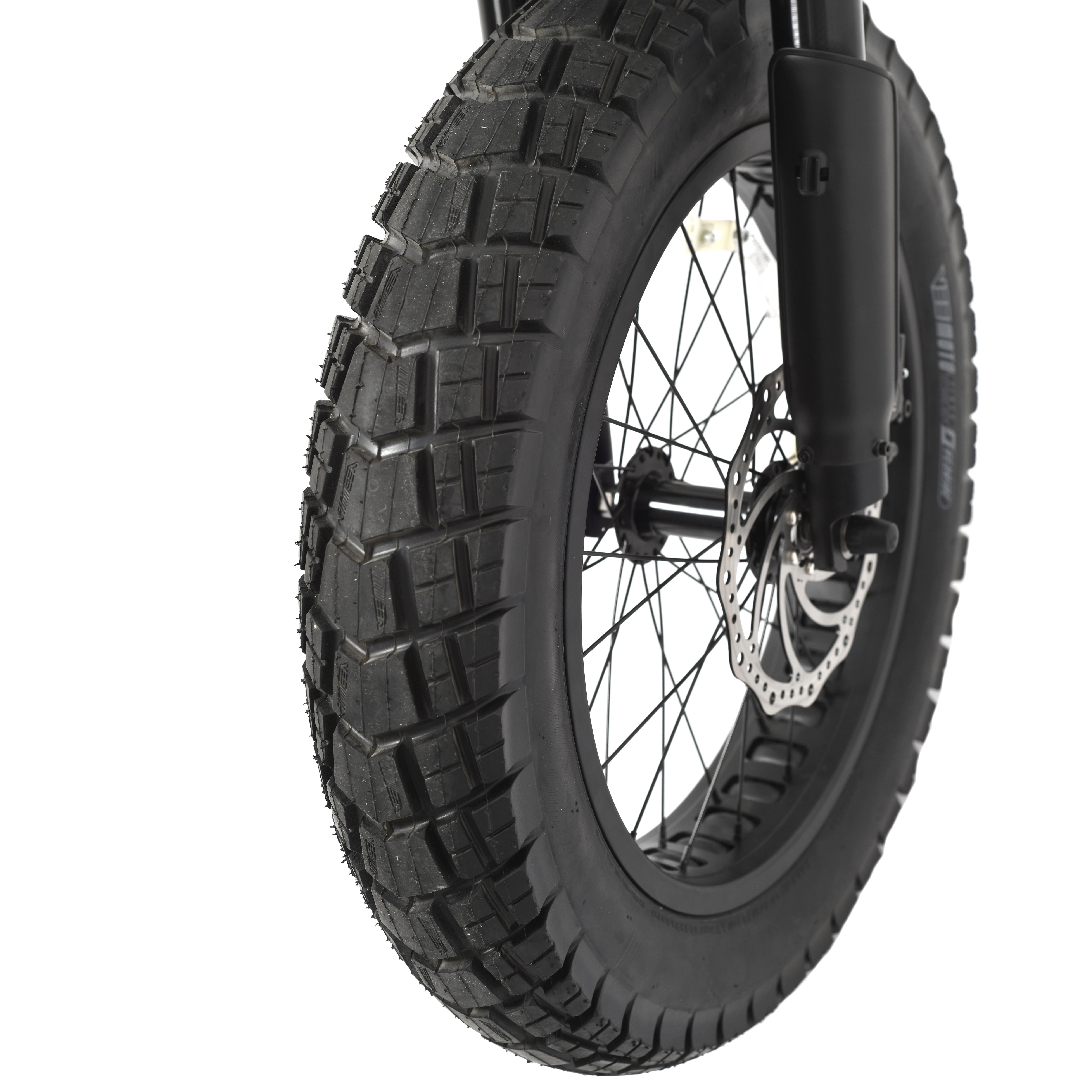 Close-up of a bicycle wheel with black fat tyre