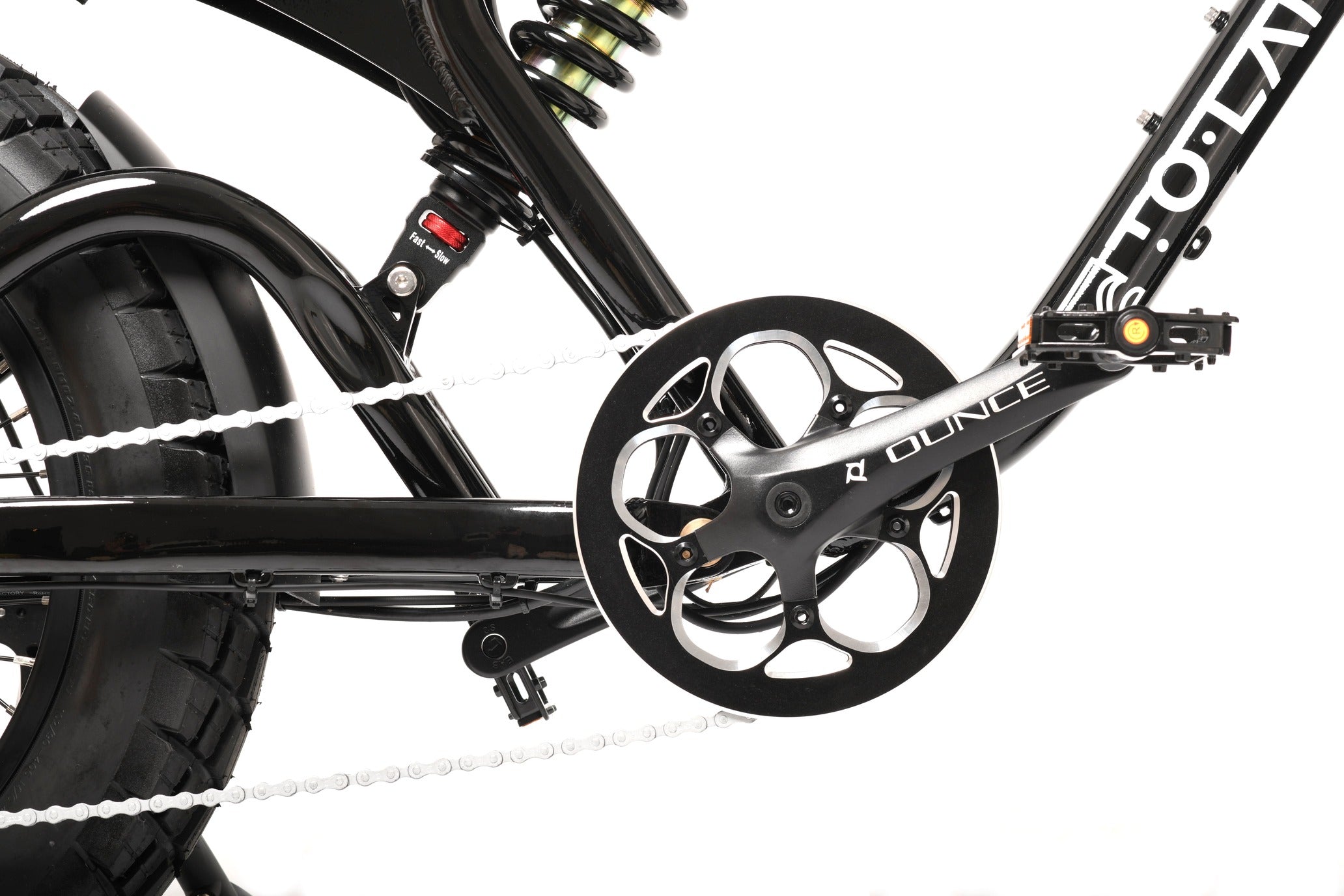 Close-up of a bicycle chain and gear system on a white background