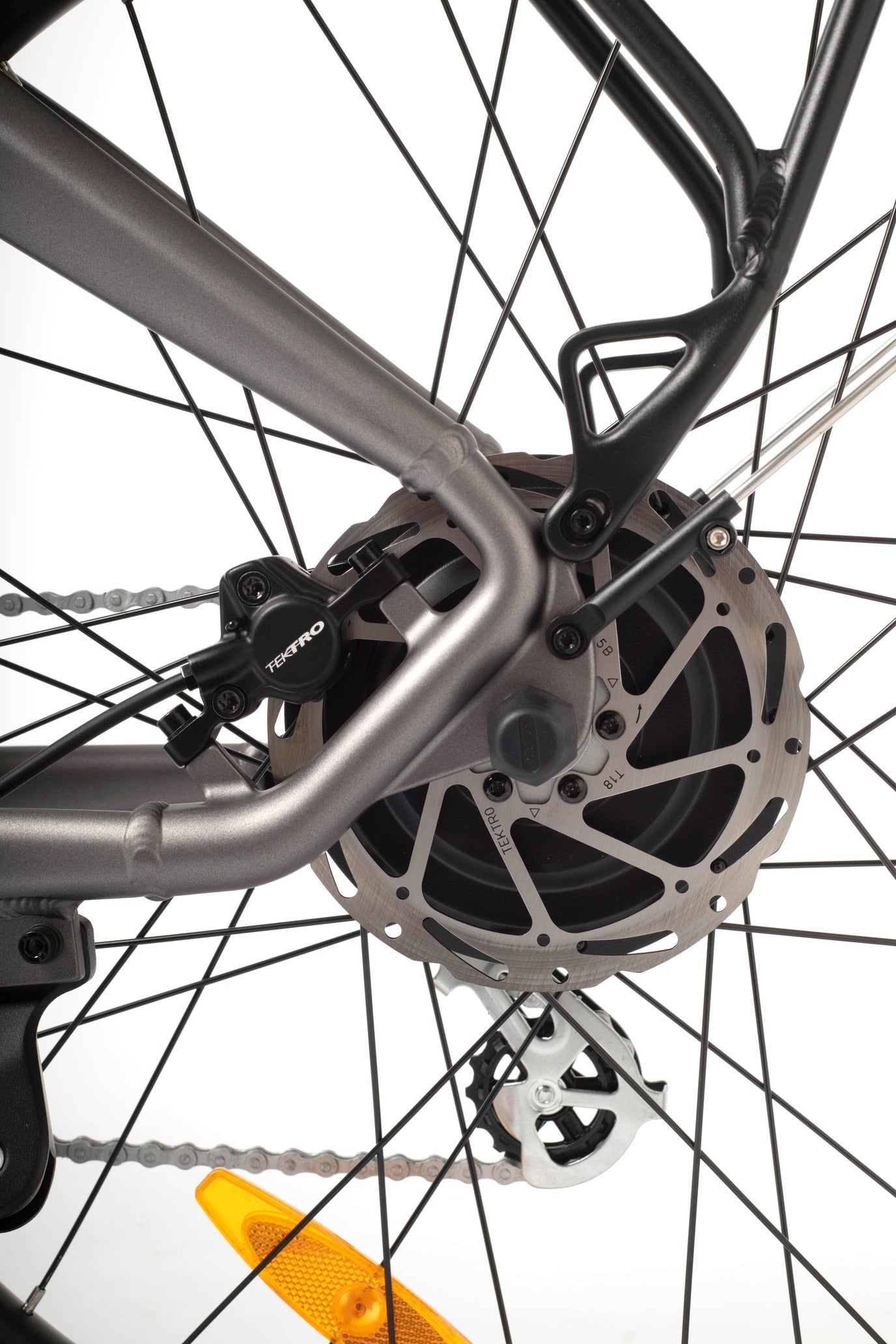 Close-up of a bicycle wheel with disc brake system on a white background