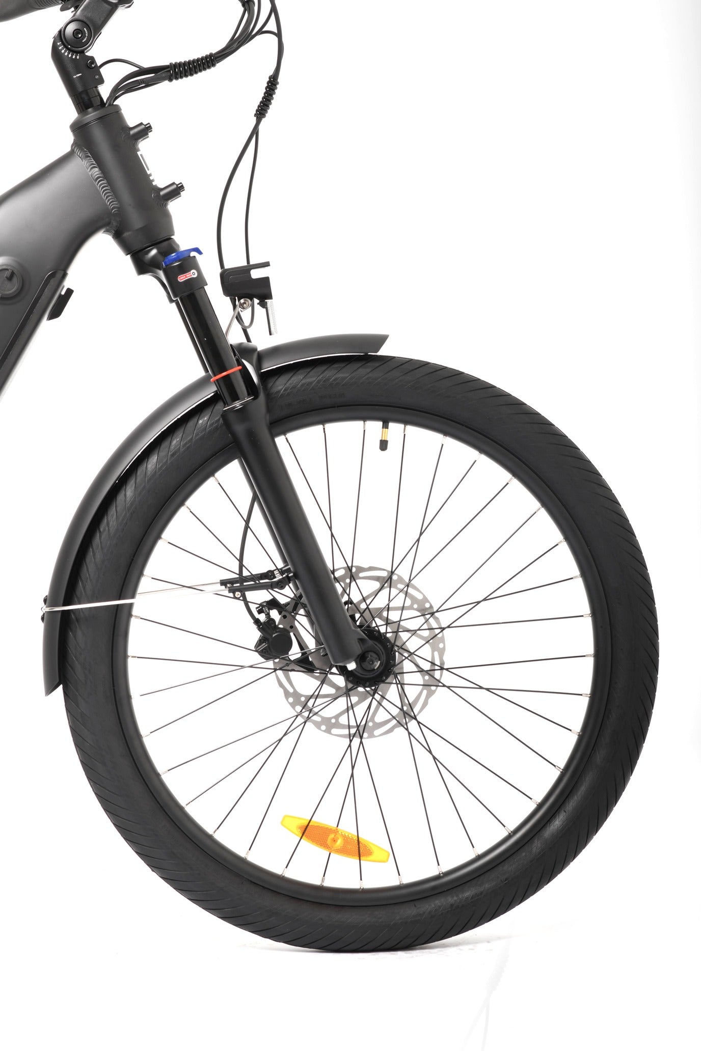 Close-up of a bicycle wheel with suspension fork on a white background