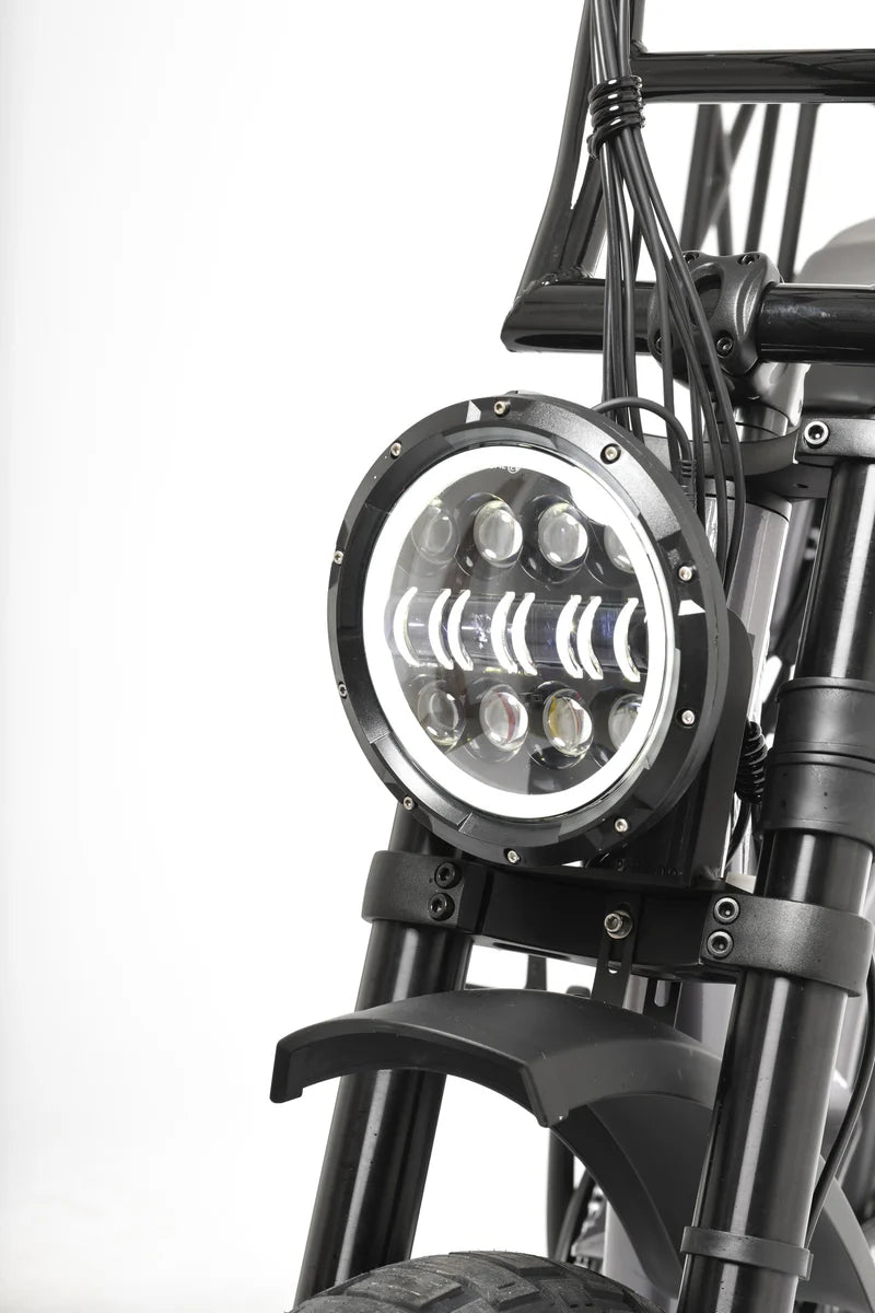 Electric bike headlight with black frame on a white background